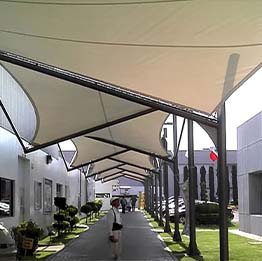 Tensile canopy walkway at a commercial complex