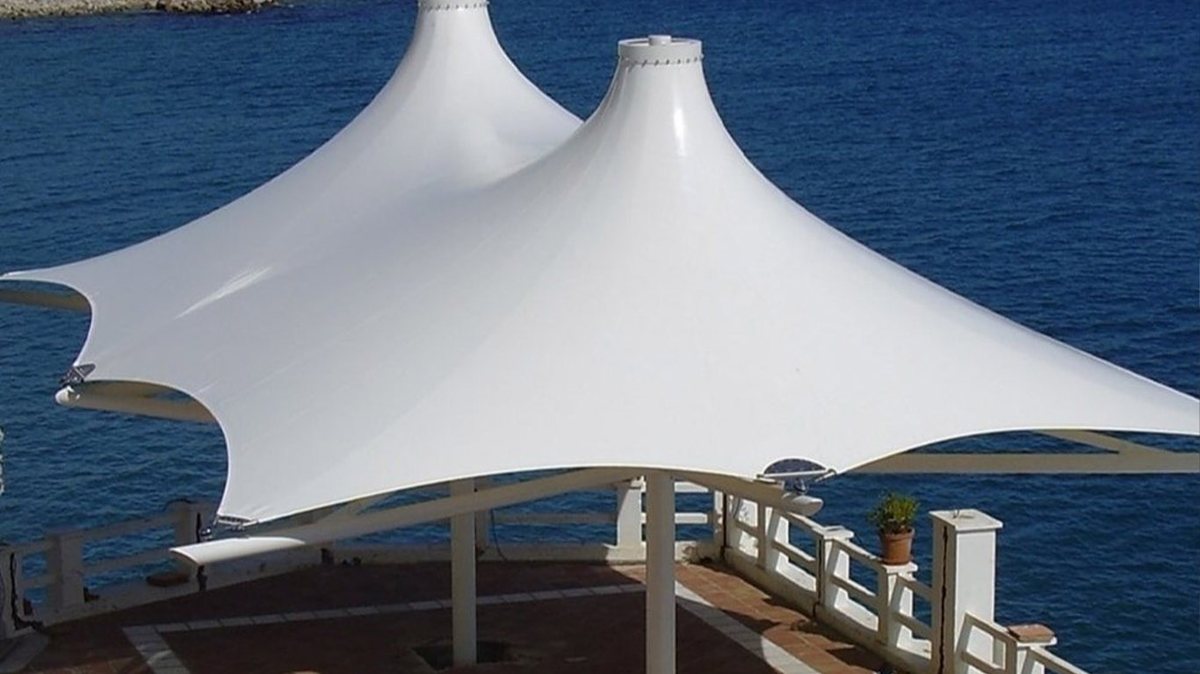 Tensile canopy over a seaside hotel deck